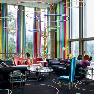 A colorfully designed room with hoops hanging from the ceiling.