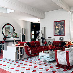 A designed room with white and red accents.